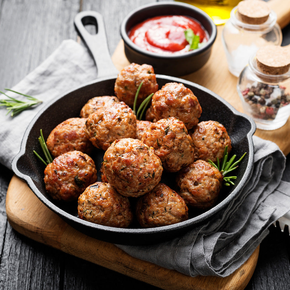 Garlic herb meatballs with grilled onion and zucchini