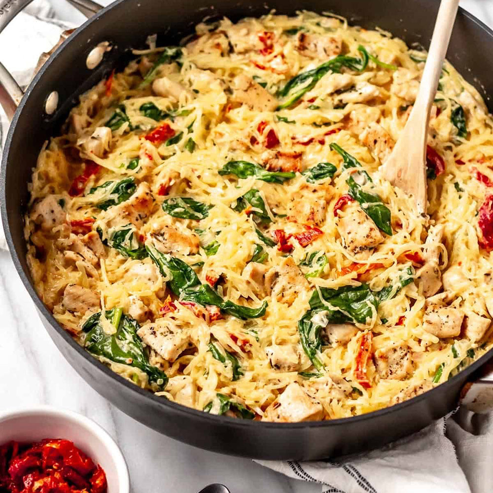 Tuscan chicken over spaghetti squash with roasted brussel sprouts
