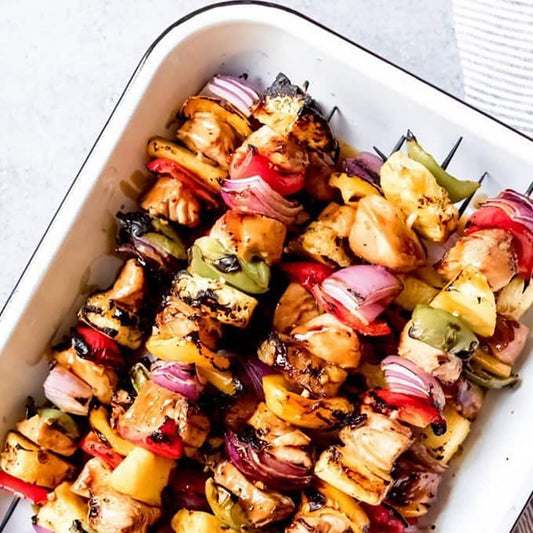 Deconstructed teriyaki chicken kabobs over brown rice